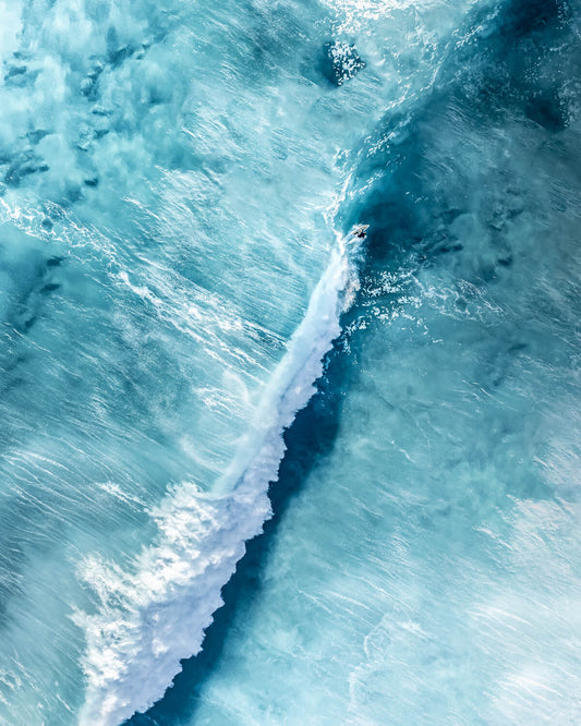 Surfer riding a long wave at Bronte Beach, Sydney, captured in fine art photography.