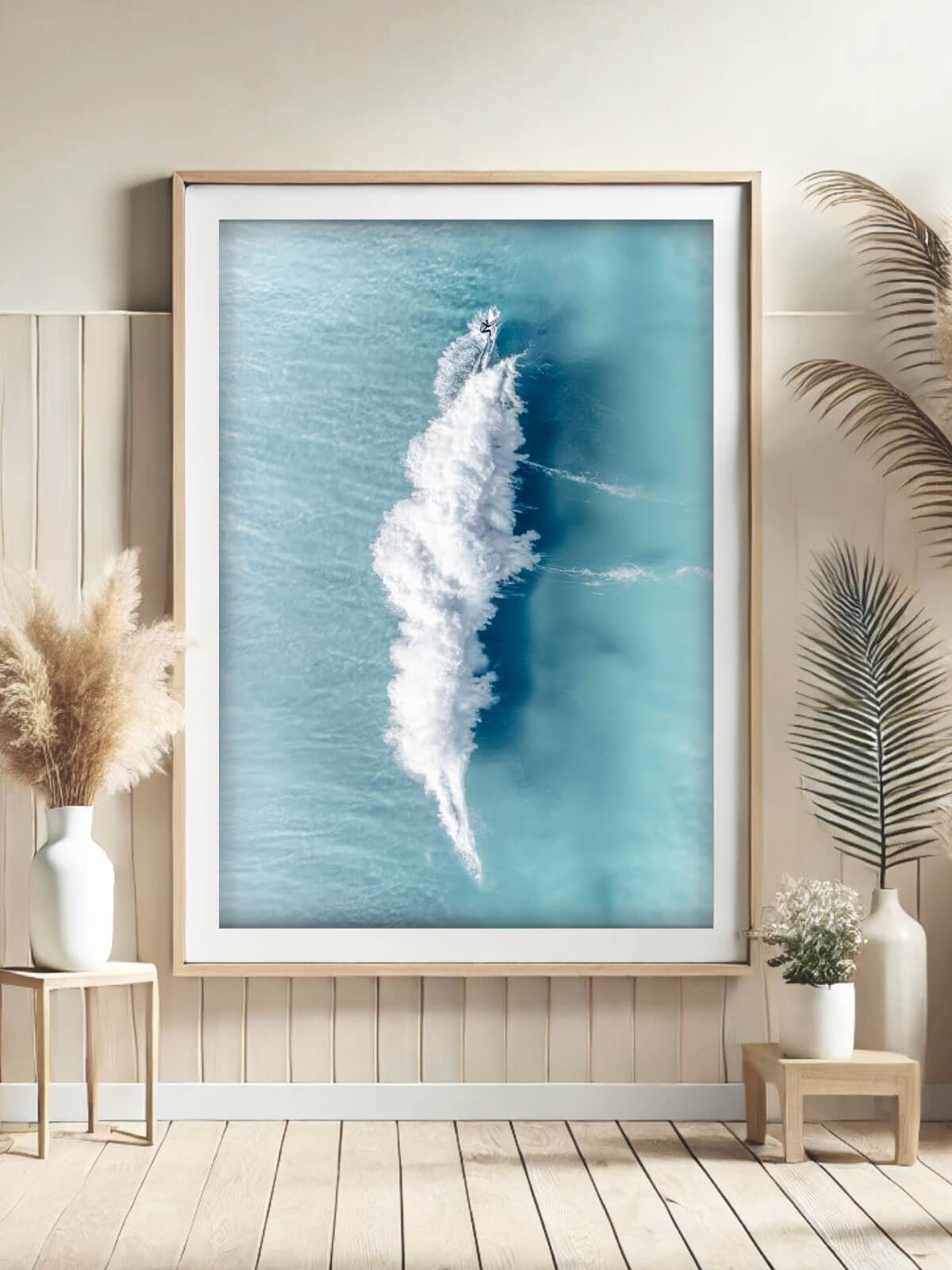 Framed aerial photograph of a surfer creating an abstract wake on turquoise waves at Bronte Beach