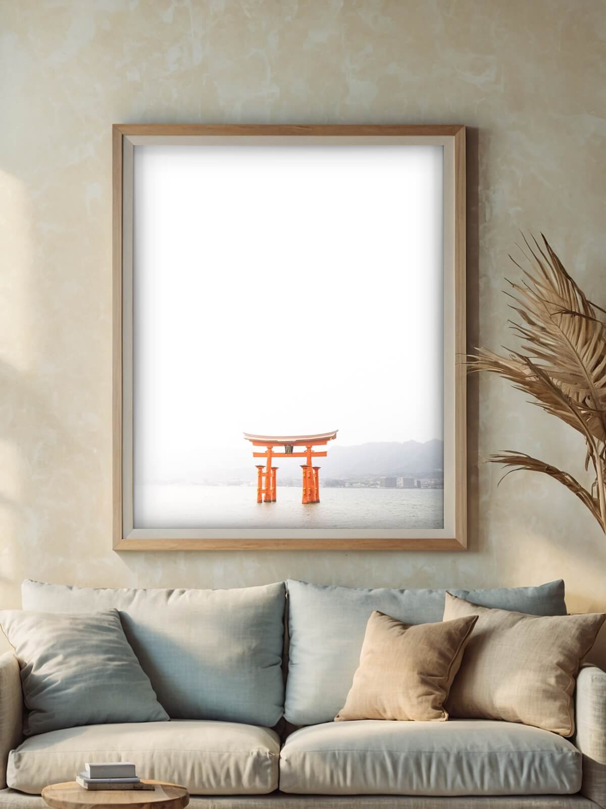 Framed photograph of the Itsukushima Shrine in Japan, capturing the iconic orange torii gate standing above calm waters in a minimalist style.