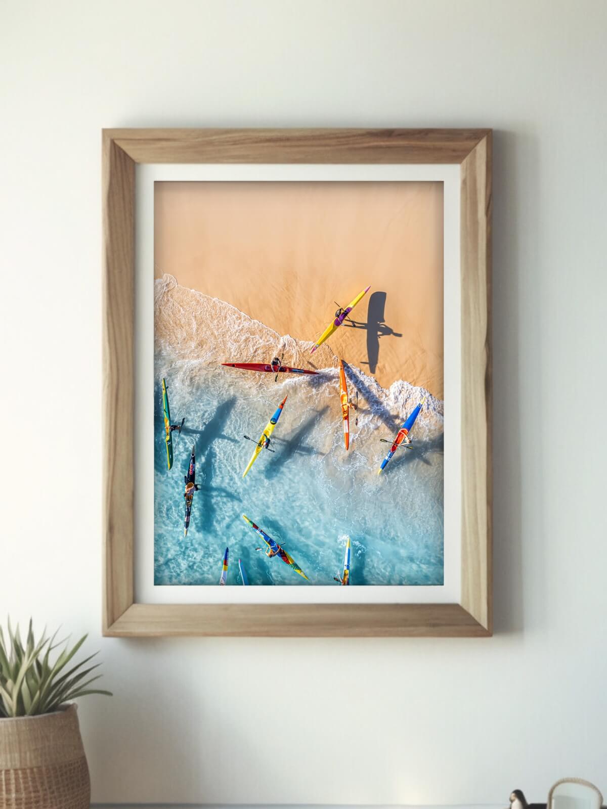 Fine art print of colorful kayakers returning to Bondi Beach in Sydney.