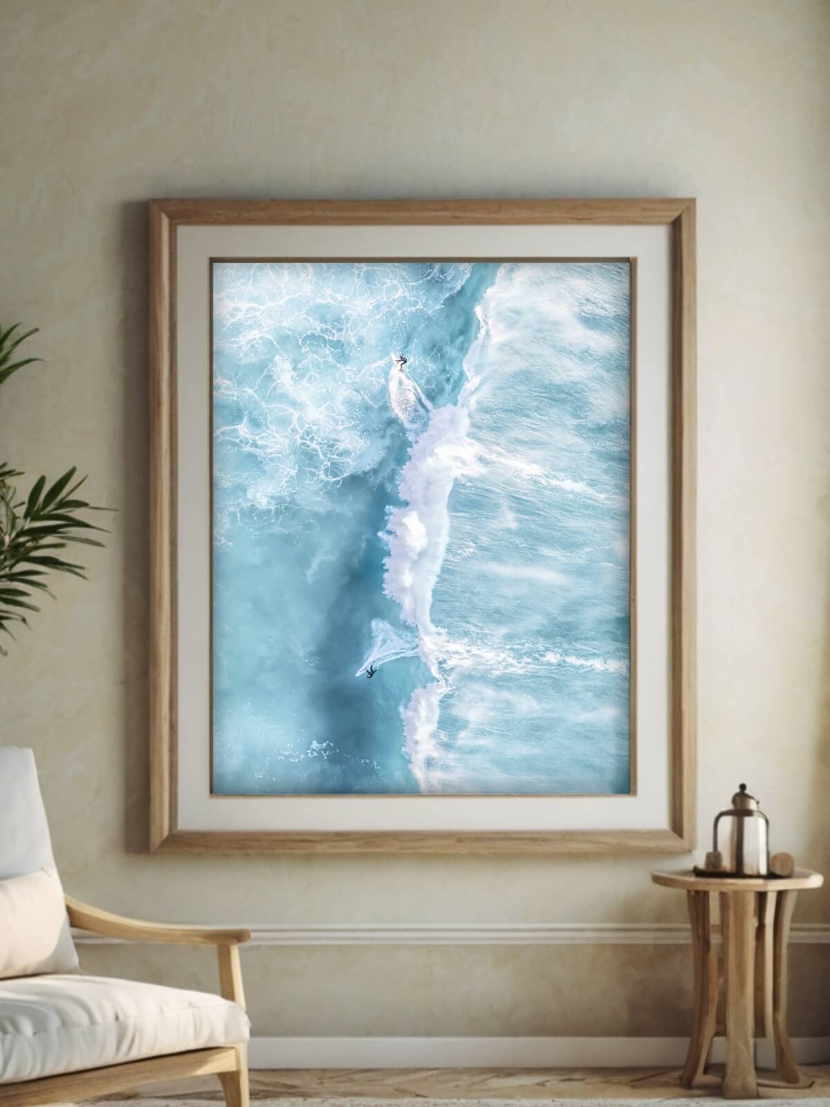 Framed aerial photo of surfers at Bronte Beach, Sydney, with vivid turquoise waves, highlighting ocean beauty in a serene coastal setting.