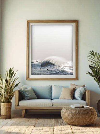 Coastal-style framed print of a winter morning swell on Sydney's coast, displayed in a cozy, beach-inspired living room.