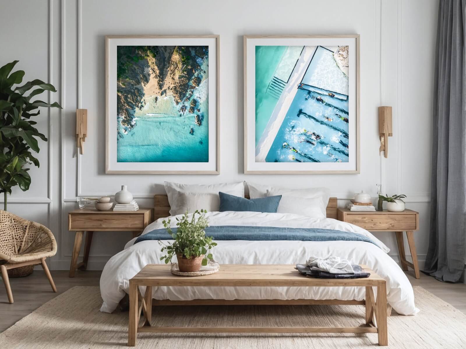 A coastal vibe bedroom with two frames. One is an aerial view of The Pass in Byron Bay, the other one the Icebergs rock pool of Bondi Beach.