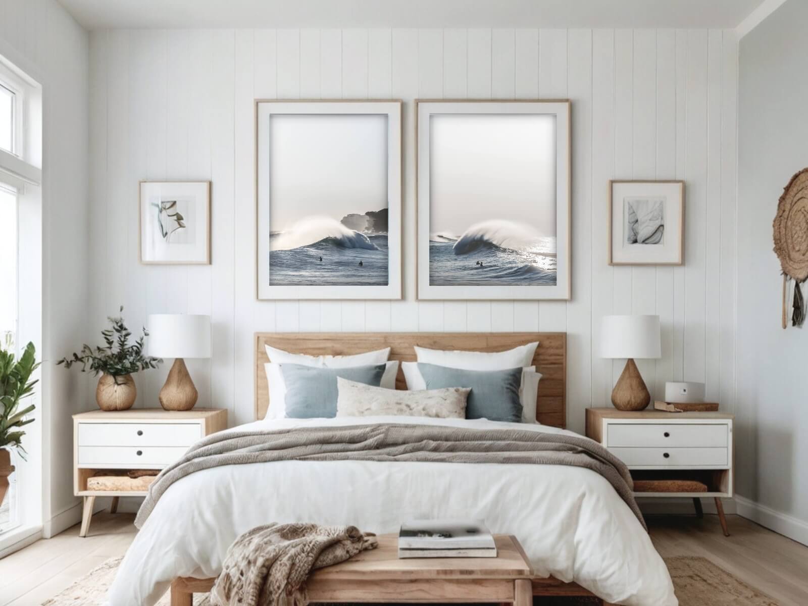 In a cosy bedroom, two frames of big waves curling in Bronte beach stand against a white wall.