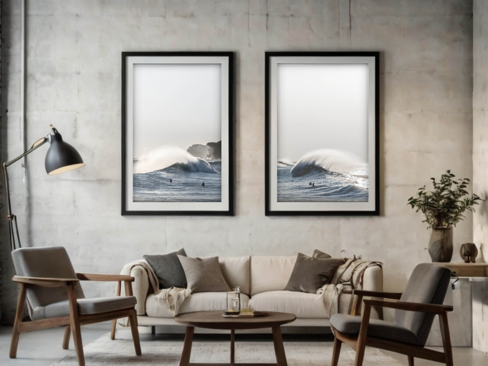 In a modern living room of dark and white colours, two frames of big waves crashing on surfers are displayed.