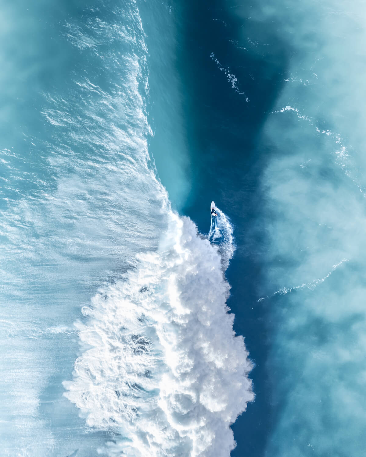 Surfer navigating large ocean wave at The Farm, Killalea, south of Sydney